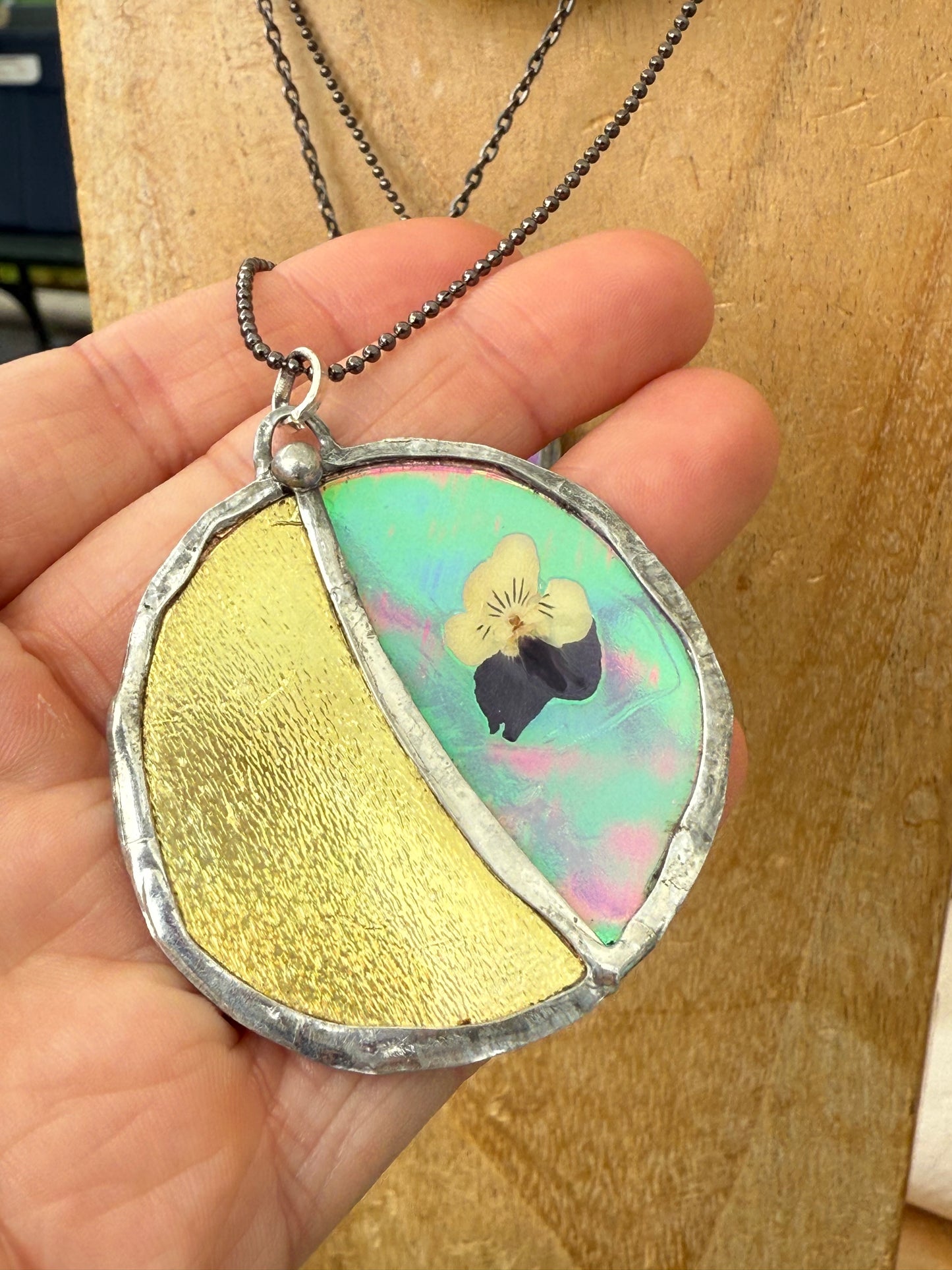 🌙 “Celestial Bloom” Necklace – Pressed Pansy on Iridescent Resins with Golden Moon