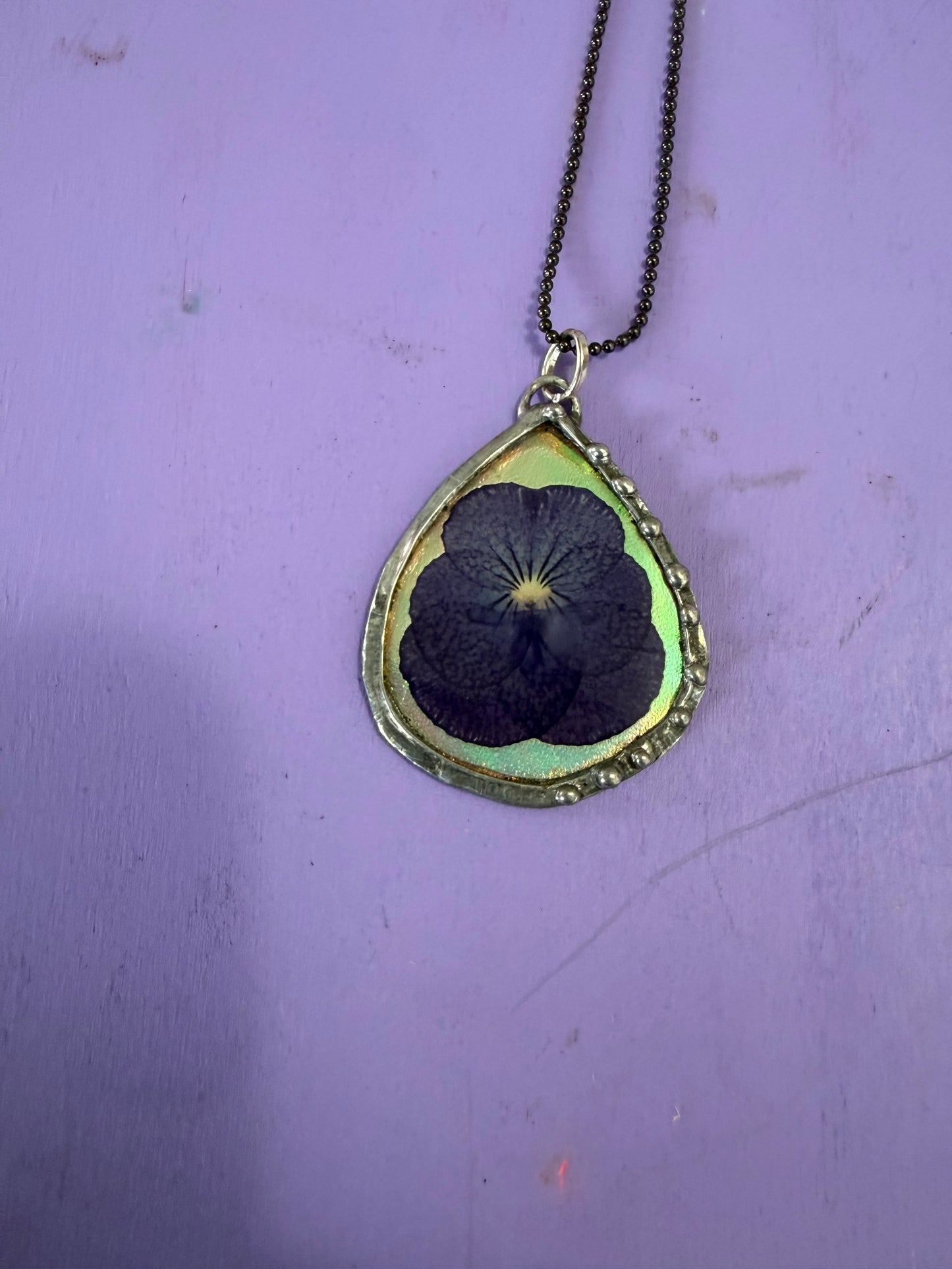 Purple Pansy Flower Necklace with Iridescent Teardrop Background