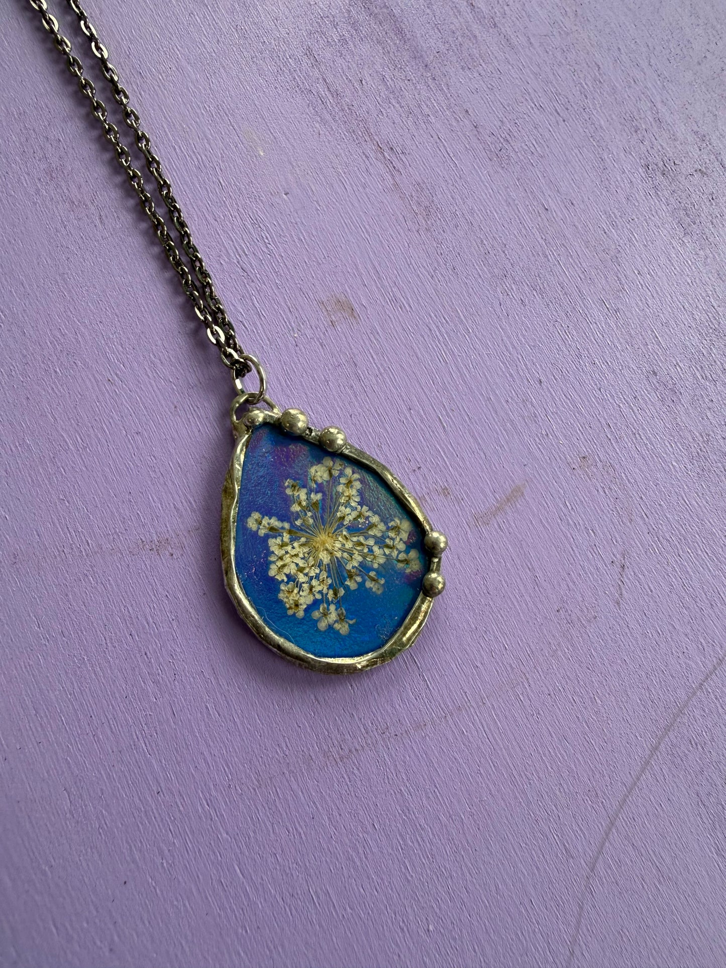 Queen Anne’s Lace Flower Necklace with Shiny Blue Background