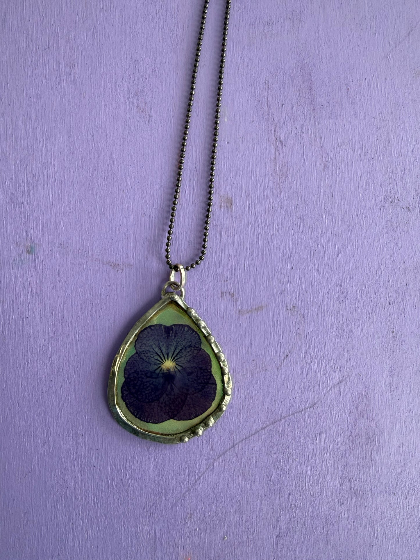 Purple Pansy Flower Necklace with Iridescent Teardrop Background