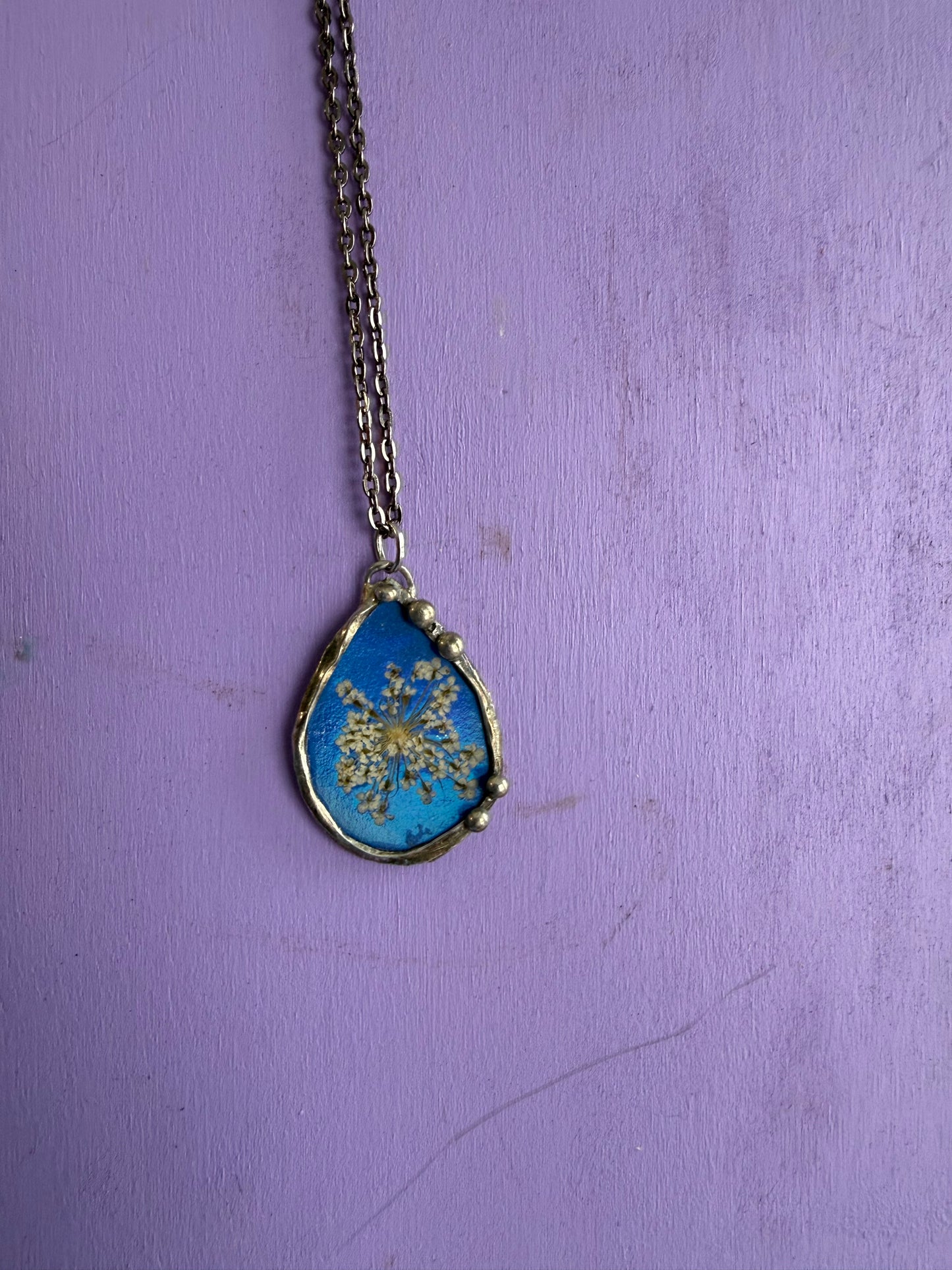 Queen Anne’s Lace Flower Necklace with Shiny Blue Background