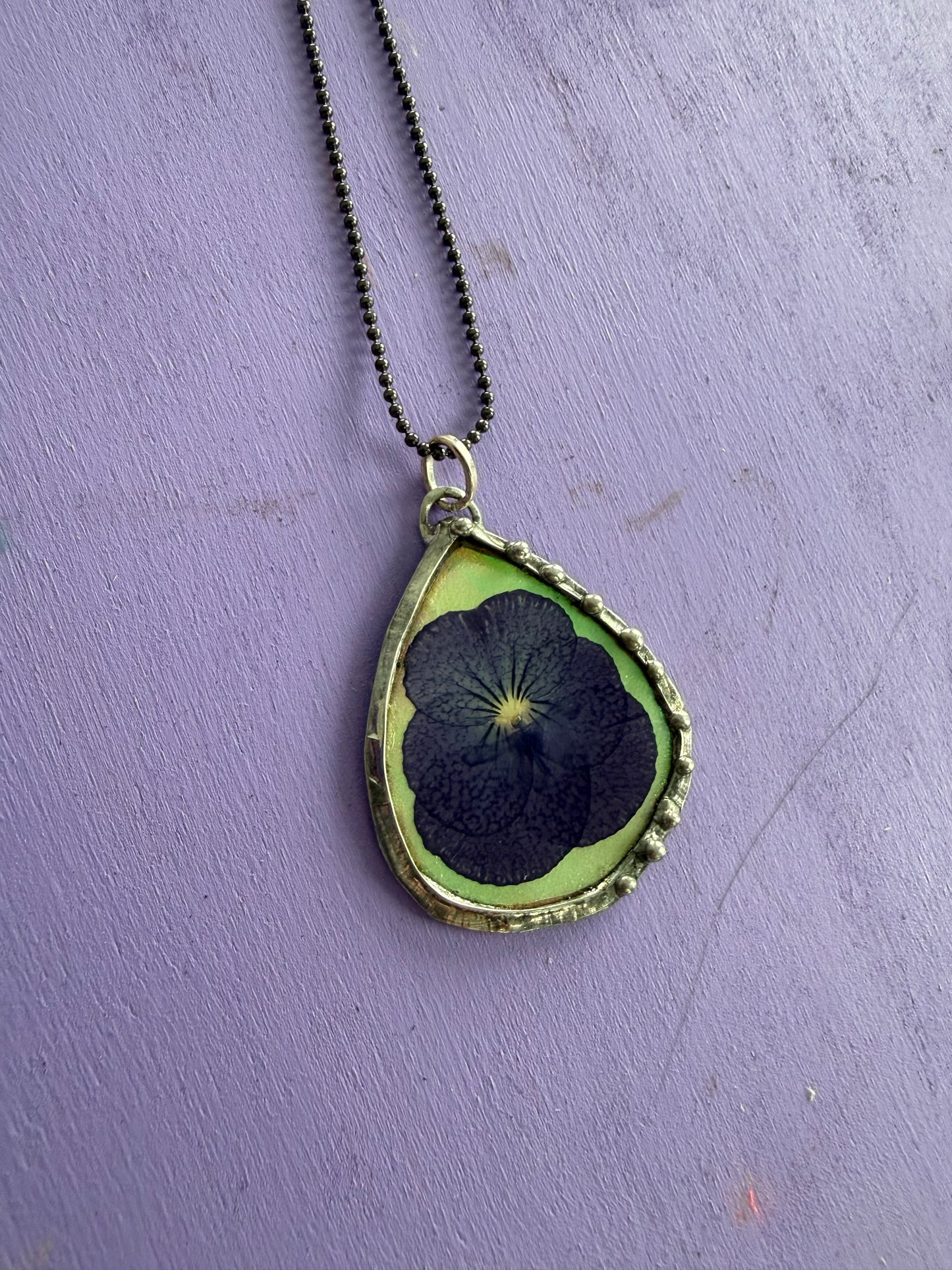Purple Pansy Flower Necklace with Iridescent Teardrop Background
